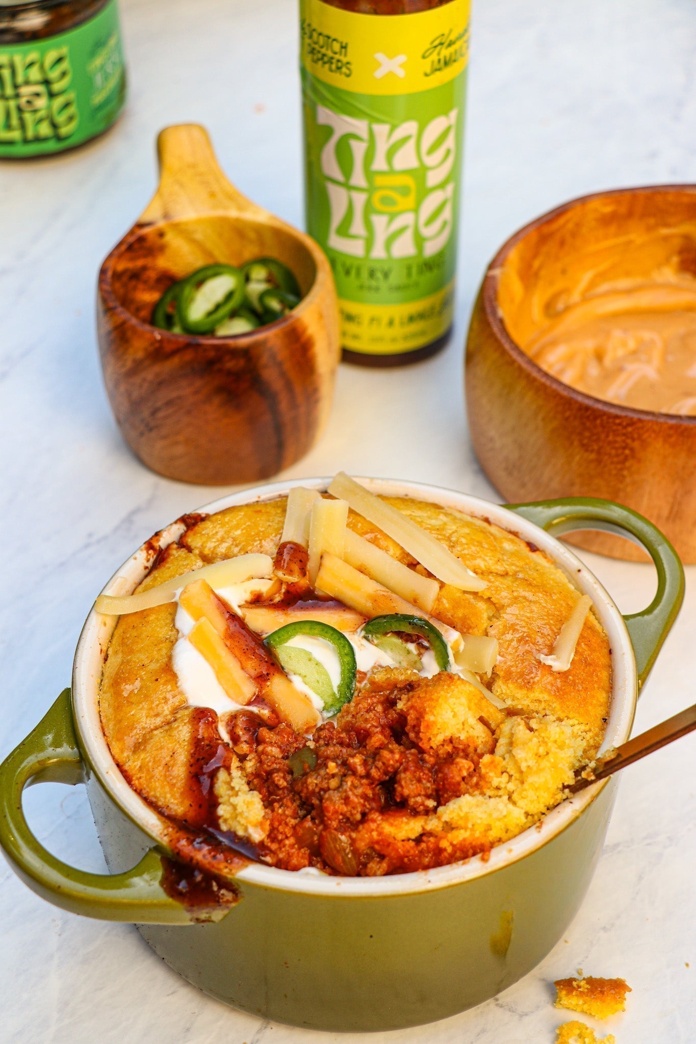 Spicy Chili Cornbread Bowl with Hot Honey Butter with Ting A Ling Jerk Sauce